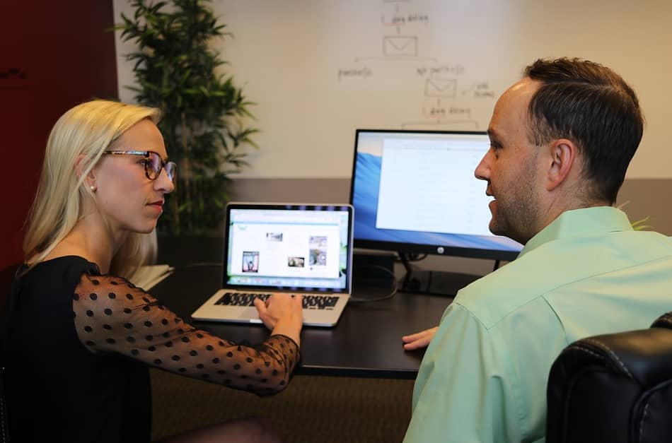two people with laptop