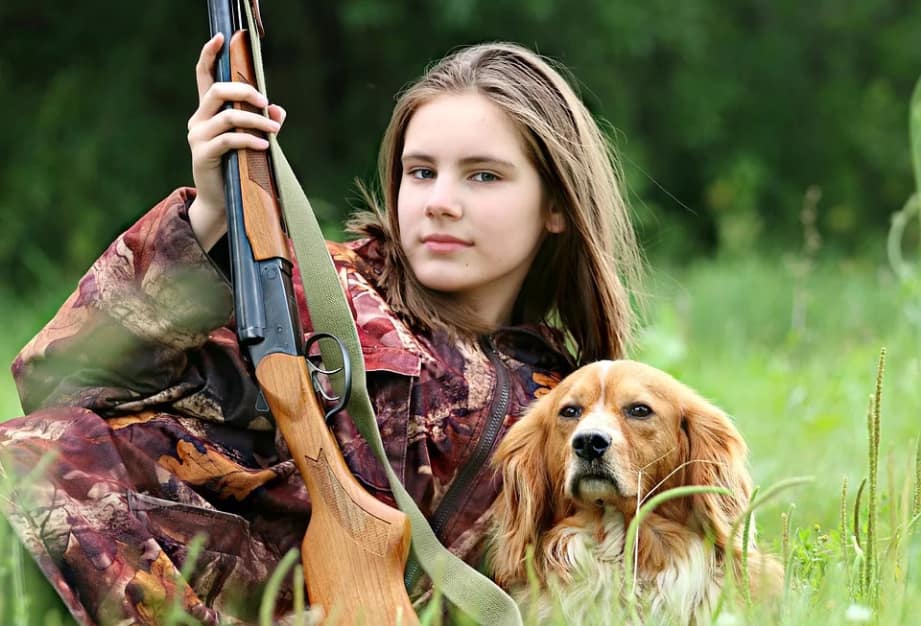 a female hunter with her dog
